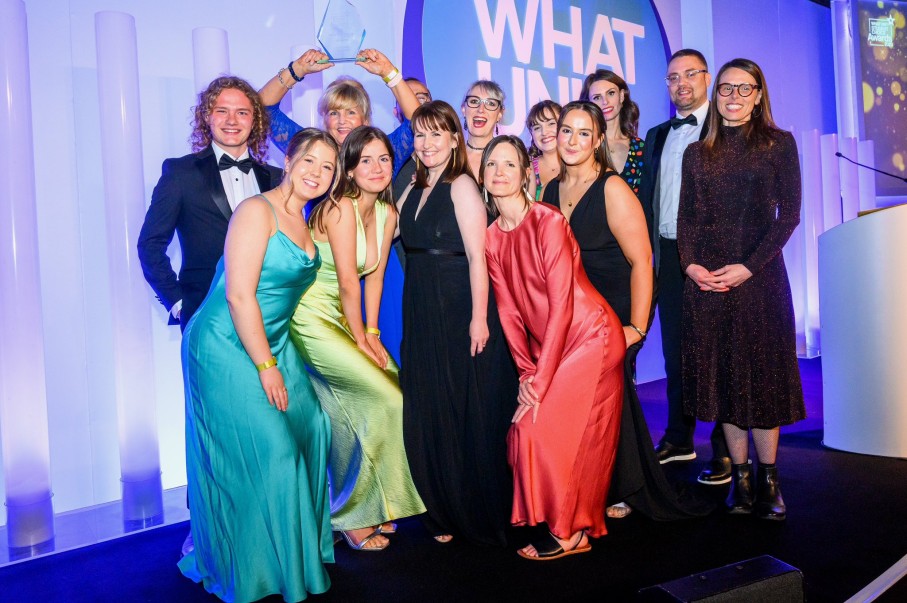 Group on stage receiving award