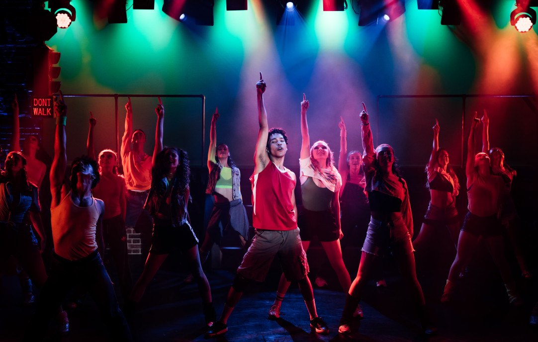 Dance performance with multicoloured stage lights