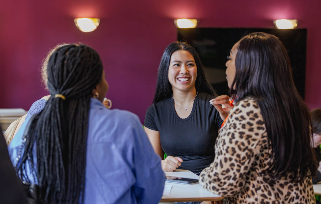 Three NTC students at a table