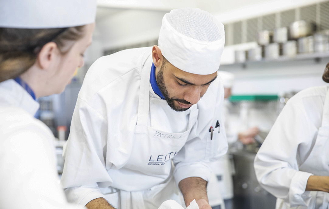 Two Leiths students in chef whites