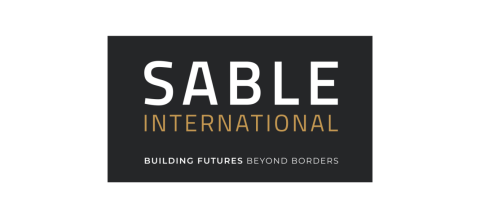 Logo: dark grey background. In white text it says SABLE and beneath in yellow text it says INTERNATIONAL. In white beneath it says BUILDING FUTURES BEYOND BORDERS