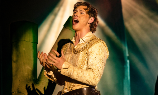 Student singing on stage