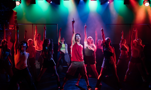 Group of students dancing on stage