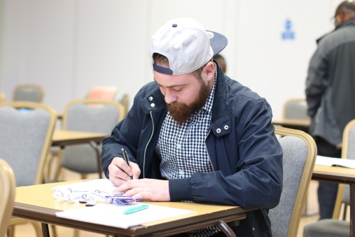 Male student studying at desk