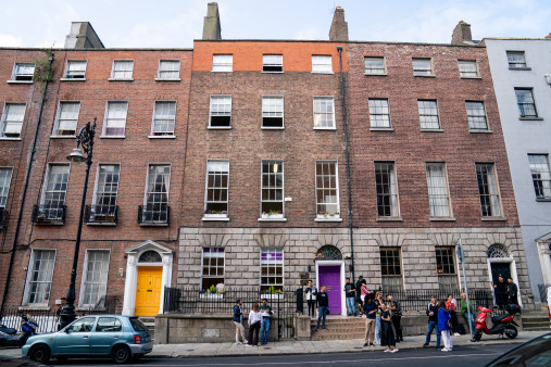 Students outside a red brick building