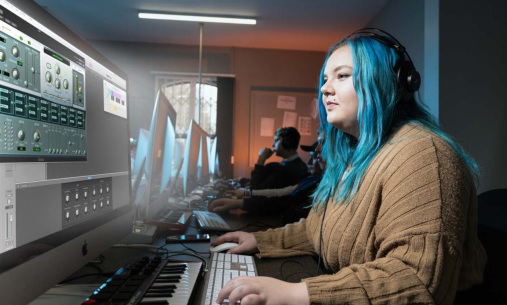 A woman with blue hair using music recording software