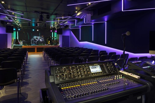 Mixing desk in studio with dark lighting