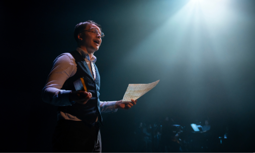 Student in spotlight on stage