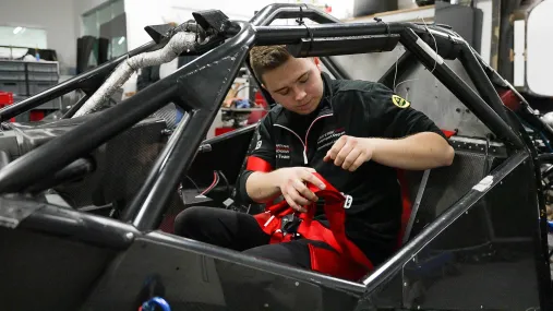 engineer working on race car chasis