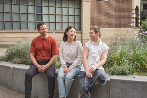 3 LIBF students sitting together outside