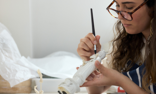 Student paints small statue