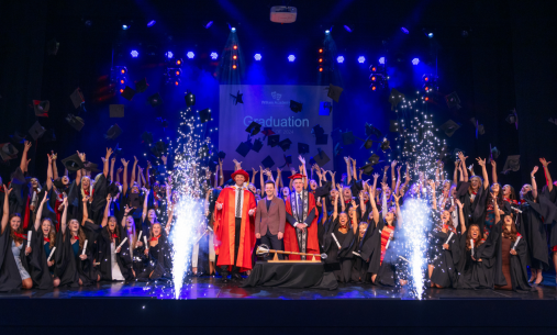 Graduation on stage with sparklers