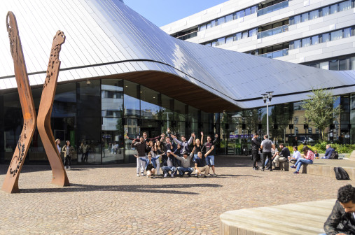 Students outside a modern building